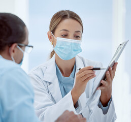 Consulting, patient and doctor with mask and documents about health, chart and results. Health, covid and physician helps patient with vaccine forms, pandemic safety regulations or rules at hospital