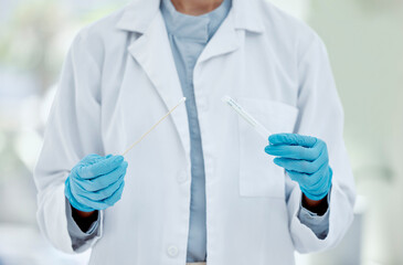 Healthcare, hand and doctor with covid test in a hospital, hands holding pcr test and swab. Research, health and innovation closeup of nurse doing analysis of corona testing results medical sample