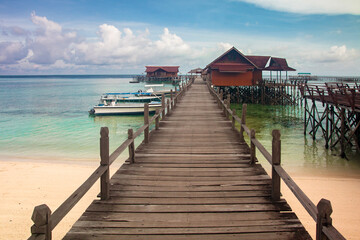 beautiful view from the pier and the inn above the water in derawan island