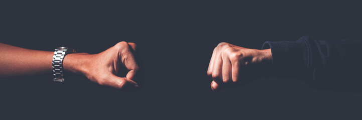 
A shot crop of two fists smashing into each other to greet, challenge, fight, and duel. - obrazy, fototapety, plakaty