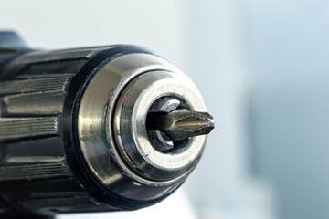 Electric drill close-up in a repair shop.