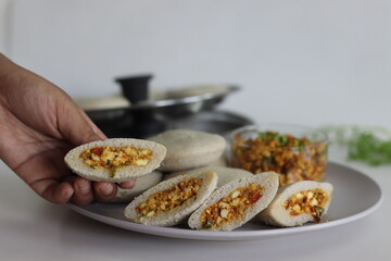 Paneer stuffed kodo millet Idly. Steamed savory cakes made of kodo millets and lentil flour stuffed...