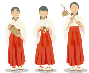 おみくじ、お守り、破魔矢を持つ巫女