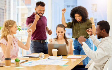 Happy team celebrate success, sales target business meeting with laptop and staff teamwork goal achievement. Young casual people smile, group working collaboration and company pride in victory fist