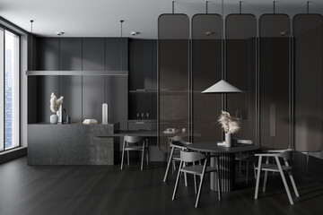 Grey kitchen interior with dining table and cooking zone, panoramic window