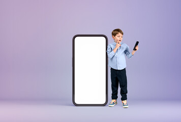 Kid with phone standing near large mockup display, online education
