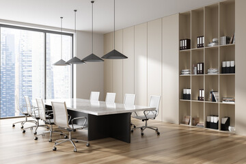 Stylish business room interior with table and seats, panoramic window