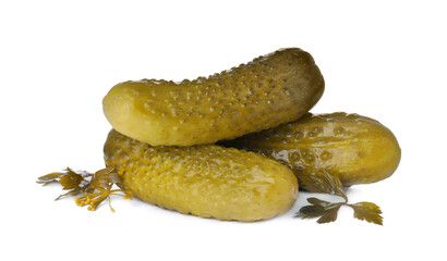 Crunchy pickled cucumbers and parsley on white background