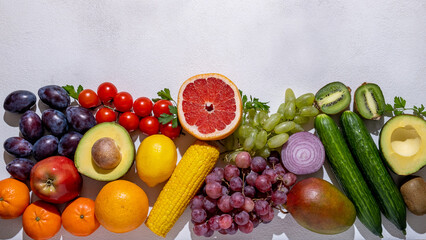 
Healthy food, fruits and vegetables on white wooden board, copy space