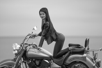 Portrait of young woman with motorcycle
