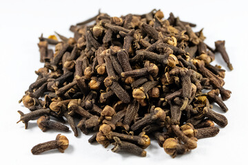 Pile of organic fresh whole clove buds isolated on white background. close up.top view.