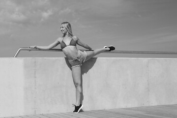 young flexible woman is training stretching