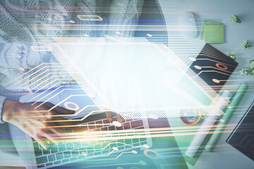 Double exposure of woman hands working on computer and data theme hologram drawing. Top View. Technology concept.
