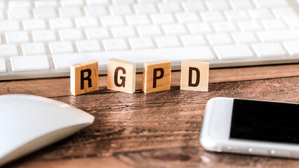 Letters on wooden pieces concept, business background with the acronym RGPD - 536690671