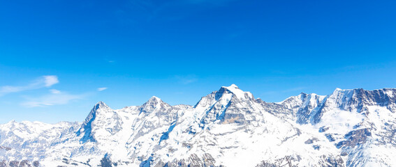 The Panoramic of  Swiss Mountain against the blue sky background