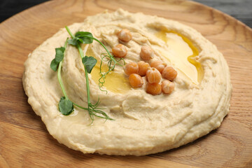 Bowl of tasty hummus with chickpeas, closeup