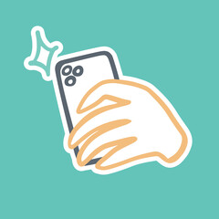
The hand holds the phone and takes pictures. Mobile photography. Vector sticker or icon in simple doodle outline style.
