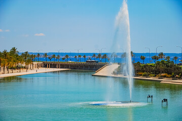 Artificial pond in Parc de La Mar and famous La Sue Cathedral under blue sky in Palma de Mallorca,...