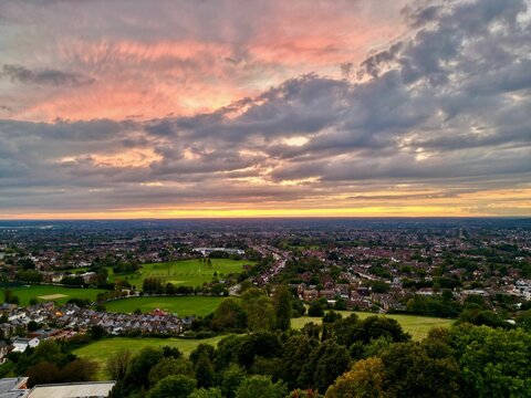 Fototapeta Cityscape of the London Harrow with mesmerizing cloud, United Kingdom, aerial