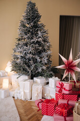 Fototapeta na wymiar Christmas decorations in kids room. Christmas tree, gifts, new year. Fastive interior