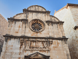 Facade of St. Saviour Church in Renaissance style with a rose window, located at the  beginning of...