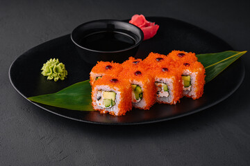 Close up Uramaki California on black plate