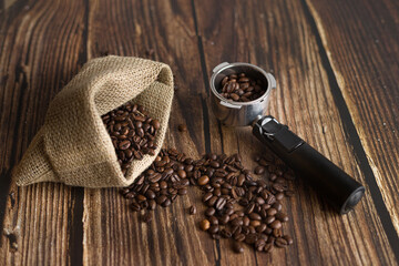 Portafilter filled with coffee and jute sack on table with hole coffee beans - Powered by Adobe