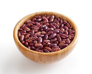 Red pinto beans in wooden bowl isolated on white background with clipping path