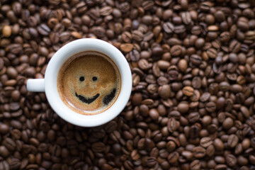 Coffee cup with espresso on coffee beans background