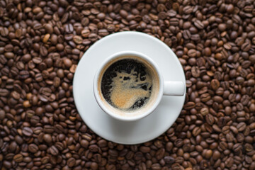 Coffee cup with espresso on coffee beans background