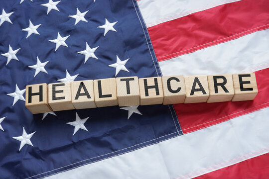 Health care reform is shown using the word Healthcare on flag of USA