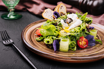 Vegetable salad with poached egg on a plate