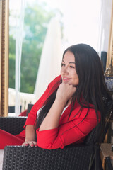 Beautiful young woman dressed in red classic tweed jacket