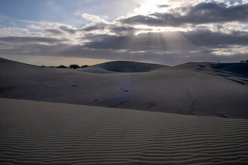 sand dunes and clouds