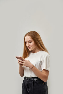 Female teenage typing or messaging on smartphone