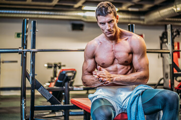Muscular bodybuilder with towel