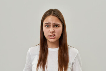 Worried girl teenage with face expression on white