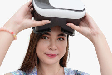 A young Filipina puts on the virtual augmented reality headset. Isolated white background studio shot.