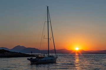 sailboat at sunrise