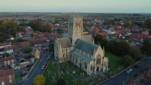 Drone filmed at sunset. St Augustine's Church. Church of England parish church located in Hedon, East Riding of Yorkshire. 