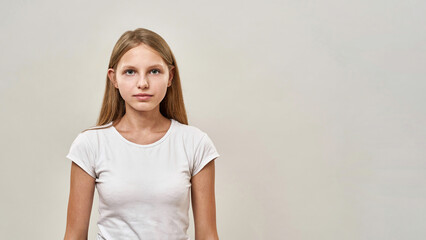 Cropped image of teenage girl looking at camera