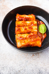 cannelloni pasta dish stuffed with meat tomato sauce healthy meal food snack diet on the table copy space food background rustic top view