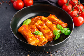 cannelloni pasta dish stuffed with meat tomato sauce healthy meal food snack diet on the table copy space food background rustic top view