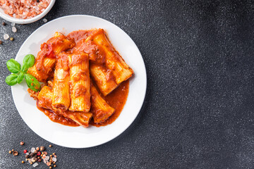 cannelloni pasta dish stuffed with meat tomato sauce healthy meal food snack diet on the table copy...