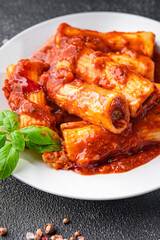 cannelloni pasta dish stuffed with meat tomato sauce healthy meal food snack diet on the table copy space food background rustic top view