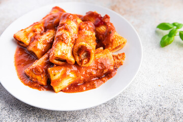 cannelloni pasta dish stuffed with meat tomato sauce healthy meal food snack diet on the table copy space food background rustic top view