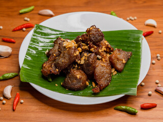 Fried pork with garlic and pepper on plate, Thai food	
