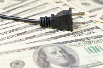 There is an electric plug on the dollar bills.