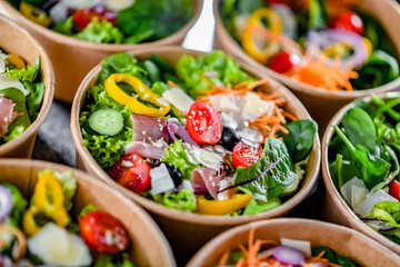 Paper boxes with pre-packaged vegetable salads ready for sale