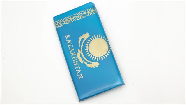 4K video. Money passes through flag of Kazakhstan. Currency exchange. Exchange of Russian cash rubles for Kazakh tenge banknotes. Immigration from Russia due to war in Ukraine and partial mobilization
